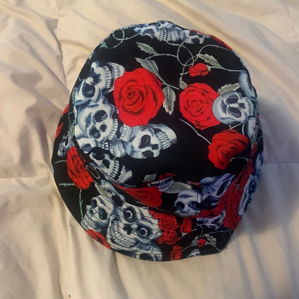 A bucket hat that has skulls and roses fits a head from head from 7 1/4 to 8 1/2